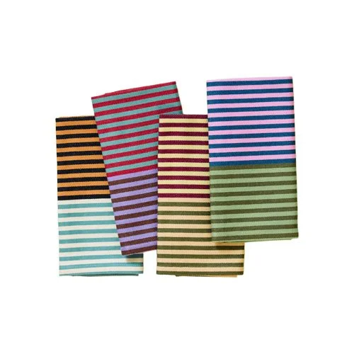 Designer patterned napkins emphasizing color, rhythm, and modern home decor language.