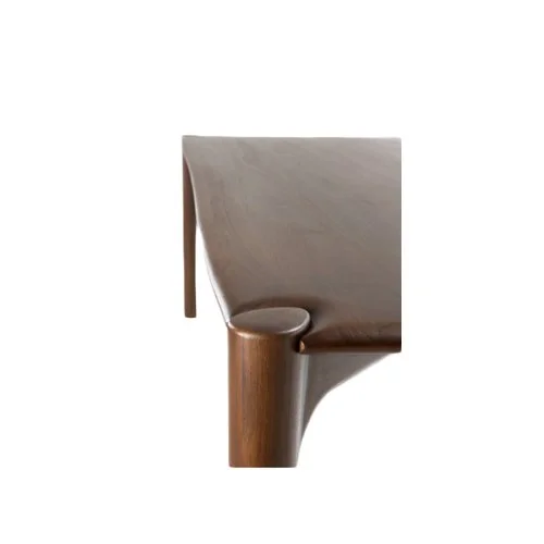 Close-up of the Pi Dining Table's hand-finished teak surface, showcasing unique grain patterns.