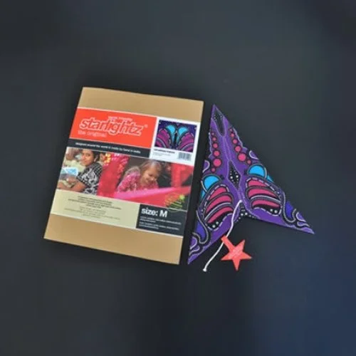 Contemporary pendant lighting accent with a handcrafted mauve paper star lantern.