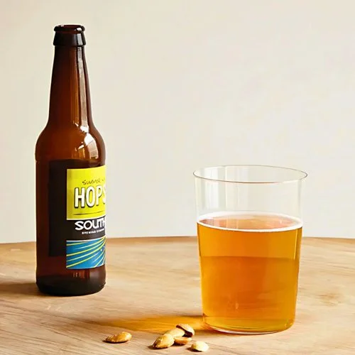 Elegant tall glass for beer, cider, or sparkling water in modern dining settings.