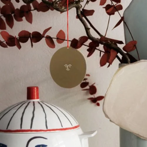 Designer brass ornament inspired by Girard’s 1965 graphic forms and joyful symbols.