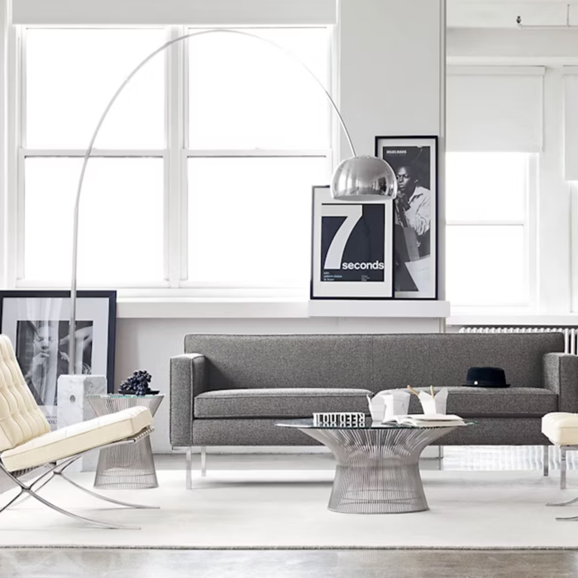 Arco floor lamp with telescoping stainless arch and sculptural marble base.