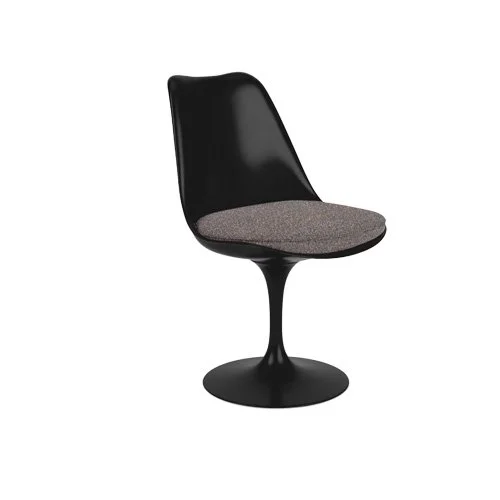 Midcentury modern dining chair by Eero Saarinen with black cast aluminum base.