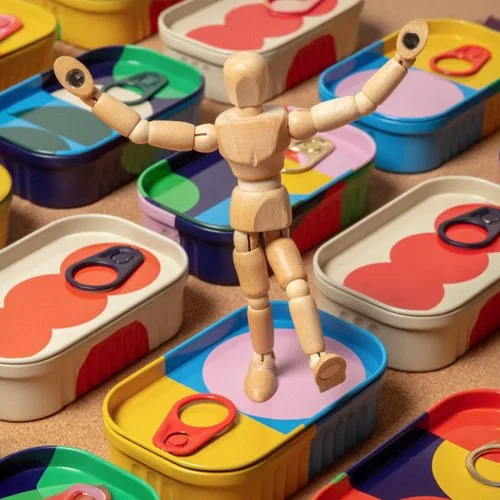 Design-led desk accessory combining playful form and classic studio reference