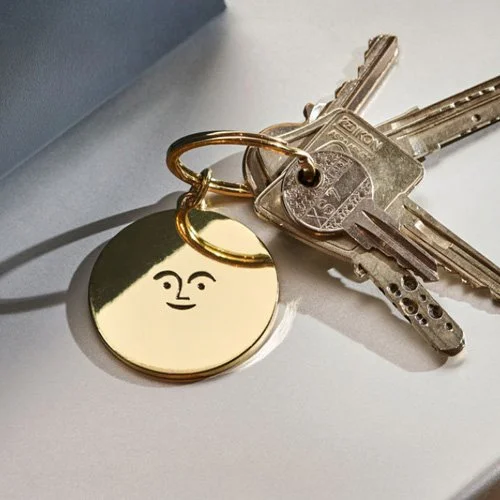 Designer key ring featuring Girard’s 1965 symbol of optimism and playful modernism.