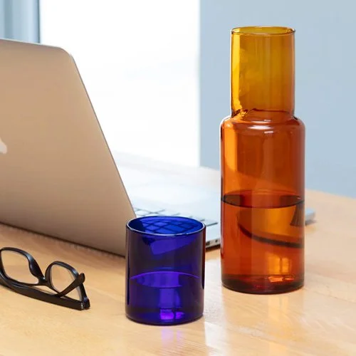 Hand-blown color block carafe balancing bold color and refined form.