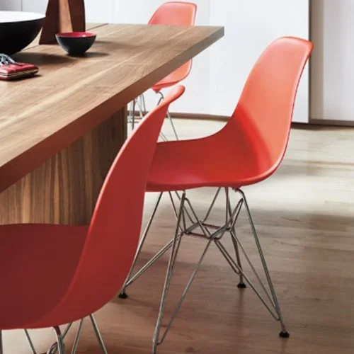 Eames_Molded_Plastic_Side_Chair_Scene2_RedOrange.jpg