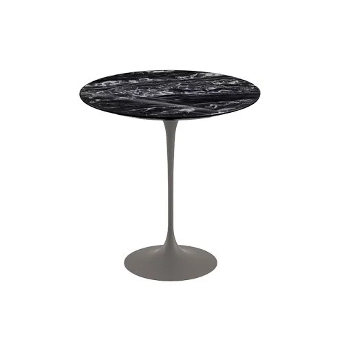Iconic side table by Eero Saarinen featuring coated marble surface and minimalist design.
