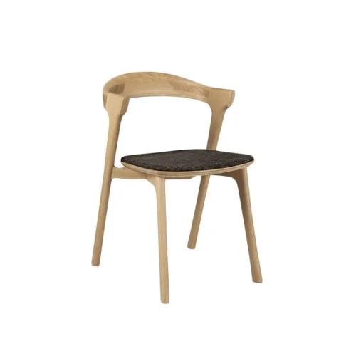 Modern dining space styled with Ethnicraft's Bok Dining Chairs in solid oak.