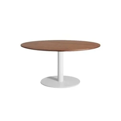 Modern round dining table from Blu Dot with sleek, sculptural lines