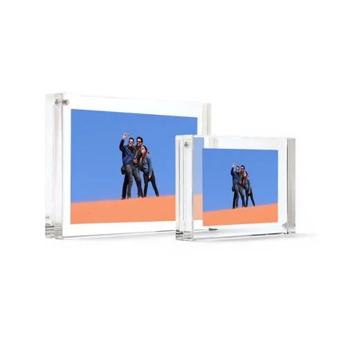 Crystal-clear acrylic photo frame by Canetti with a frameless, magnetic design for a sleek, floating photo display.