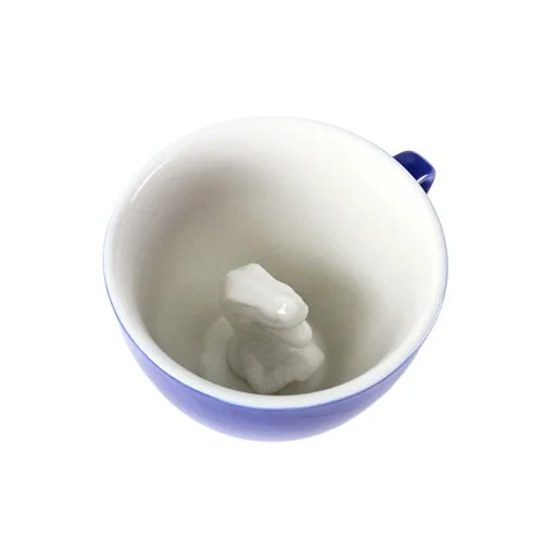 Glossy ceramic mug featuring a hidden Tyrannosaurus rex figure.