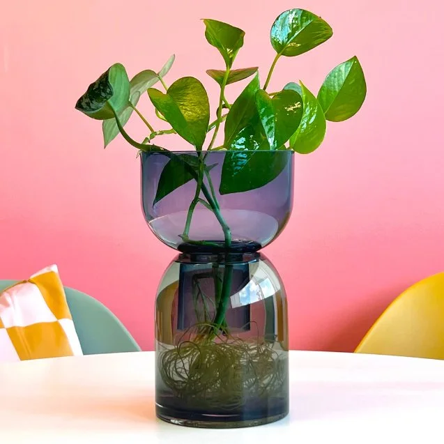 Two-tone sculptural vase with cool, minimalist design and reversible form.