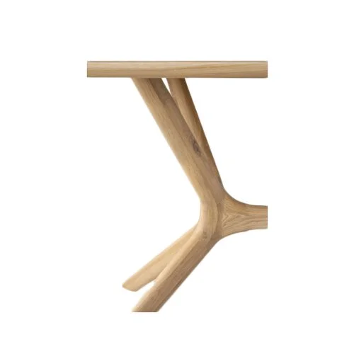 Close-up of the X Dining Table's handcrafted X-shaped legs, showcasing its robust construction and elegant design.