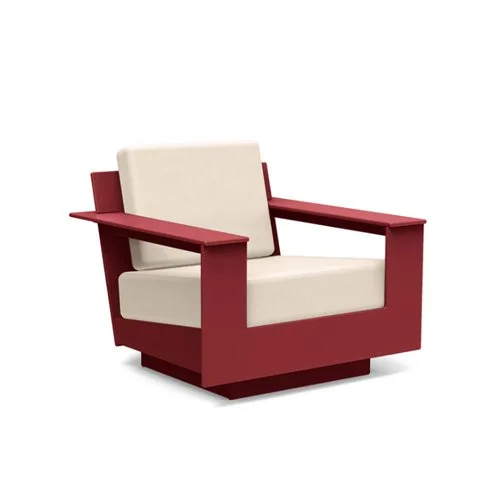 Low-slung modern outdoor lounge chair built from eco-friendly recycled plastic.
