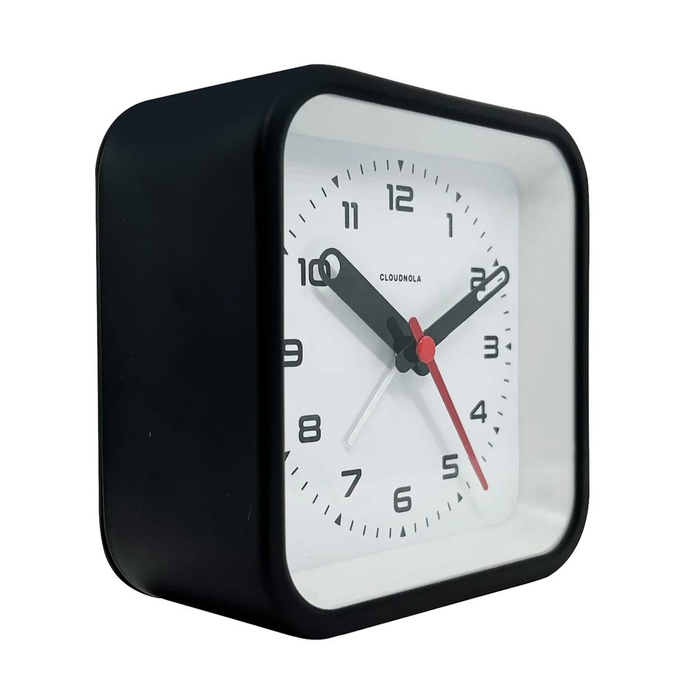 Compact black quartz clock with retro-inspired style