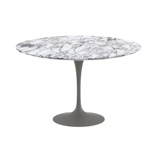 Modern dining table with sculptural tulip base and polished grey marble surface.