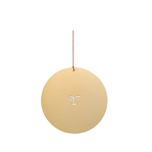 Alexander Girard Sun Ornament by Vitra in polished brass with iconic sun motif.