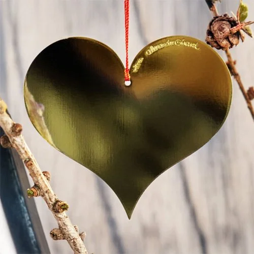 Designer ornament featuring Girard’s 1965 heart symbol, a timeless modernist design.