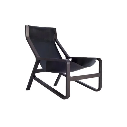 Minimalist lounge chair with soft sand leather sling and natural wood structure.