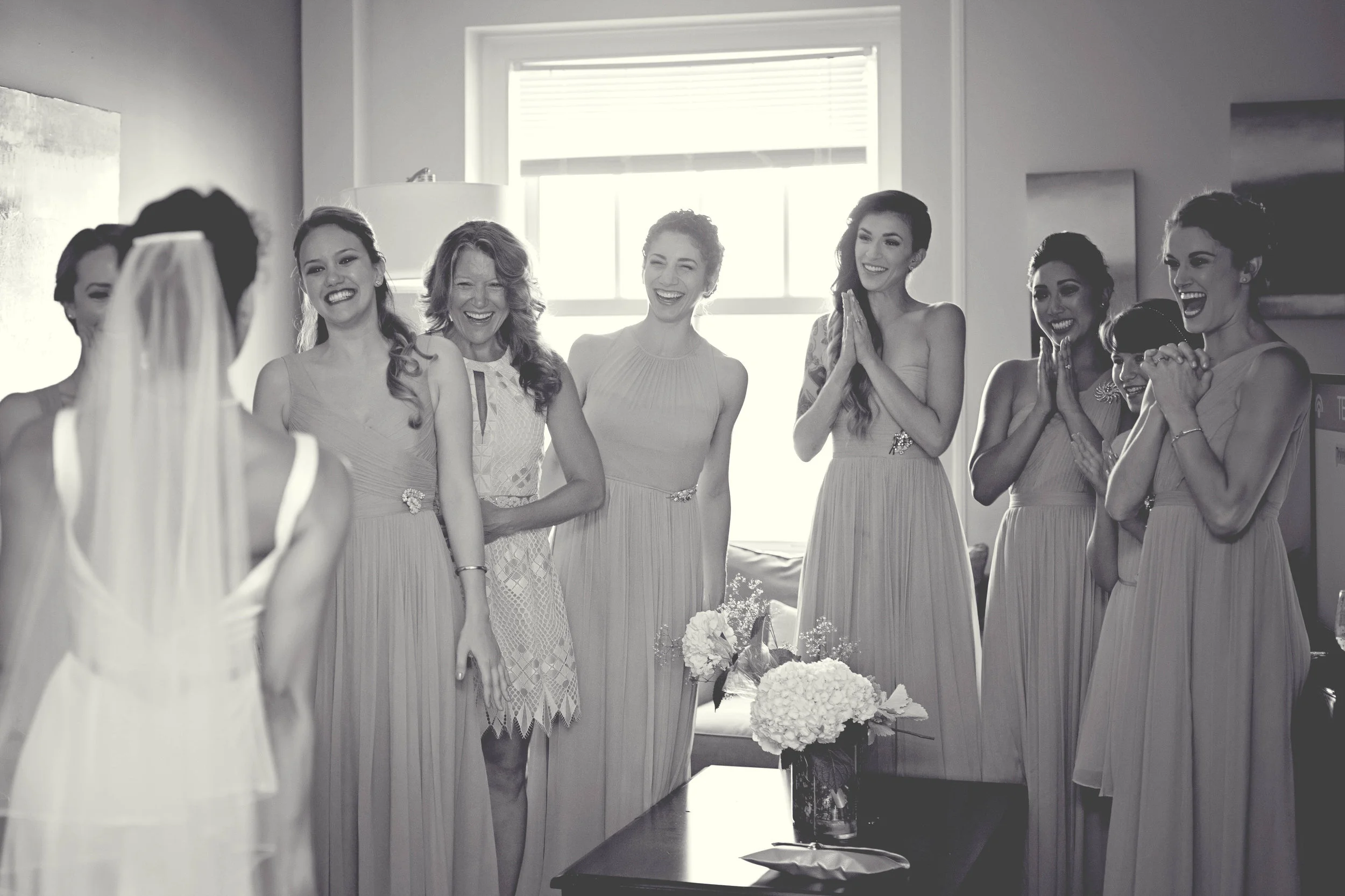 bridal first look with bridesmaids in hotel room at the john marshall in richmond virginia photo.jpeg