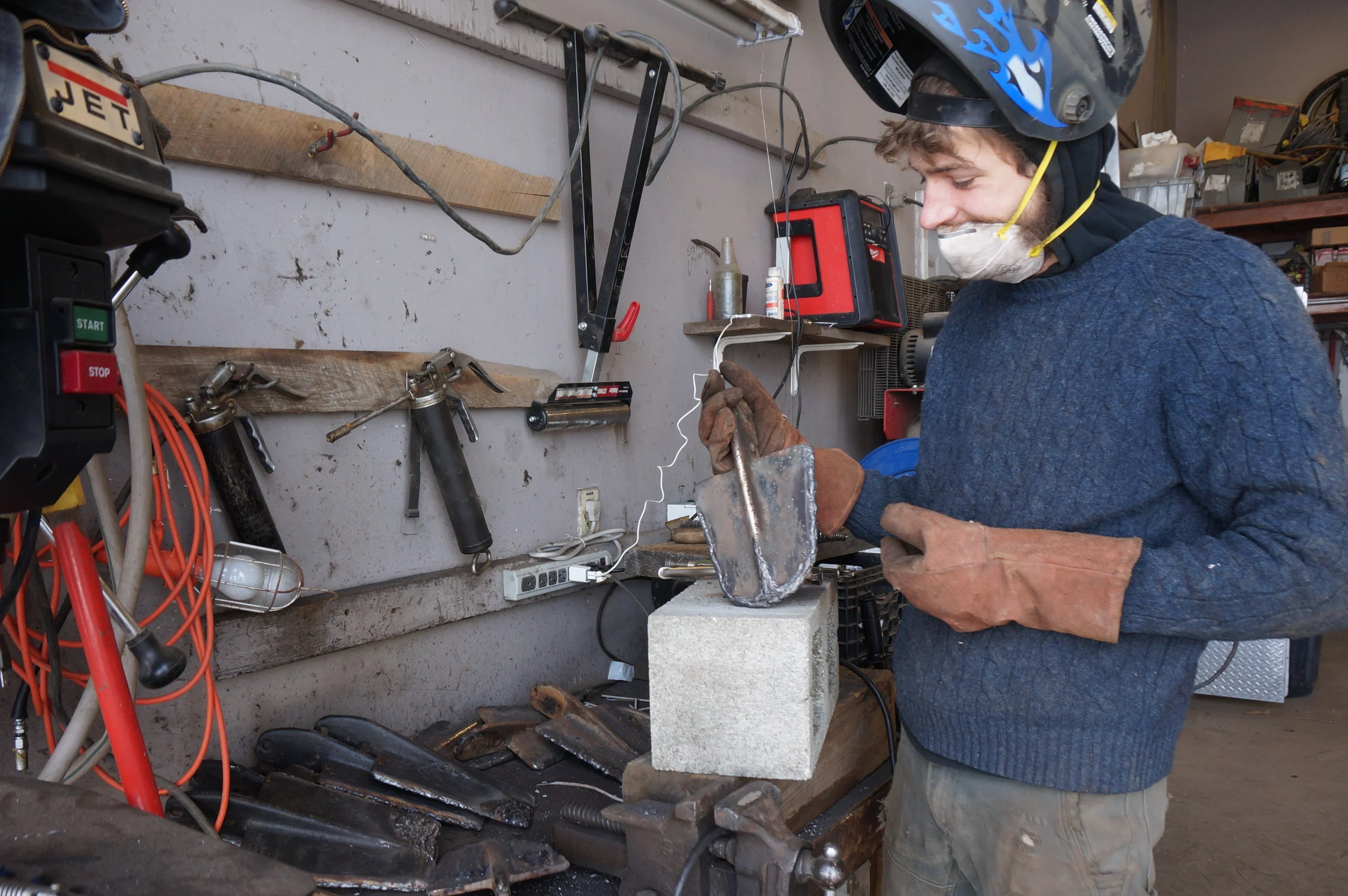 Sam Thomas inspecting worn spade