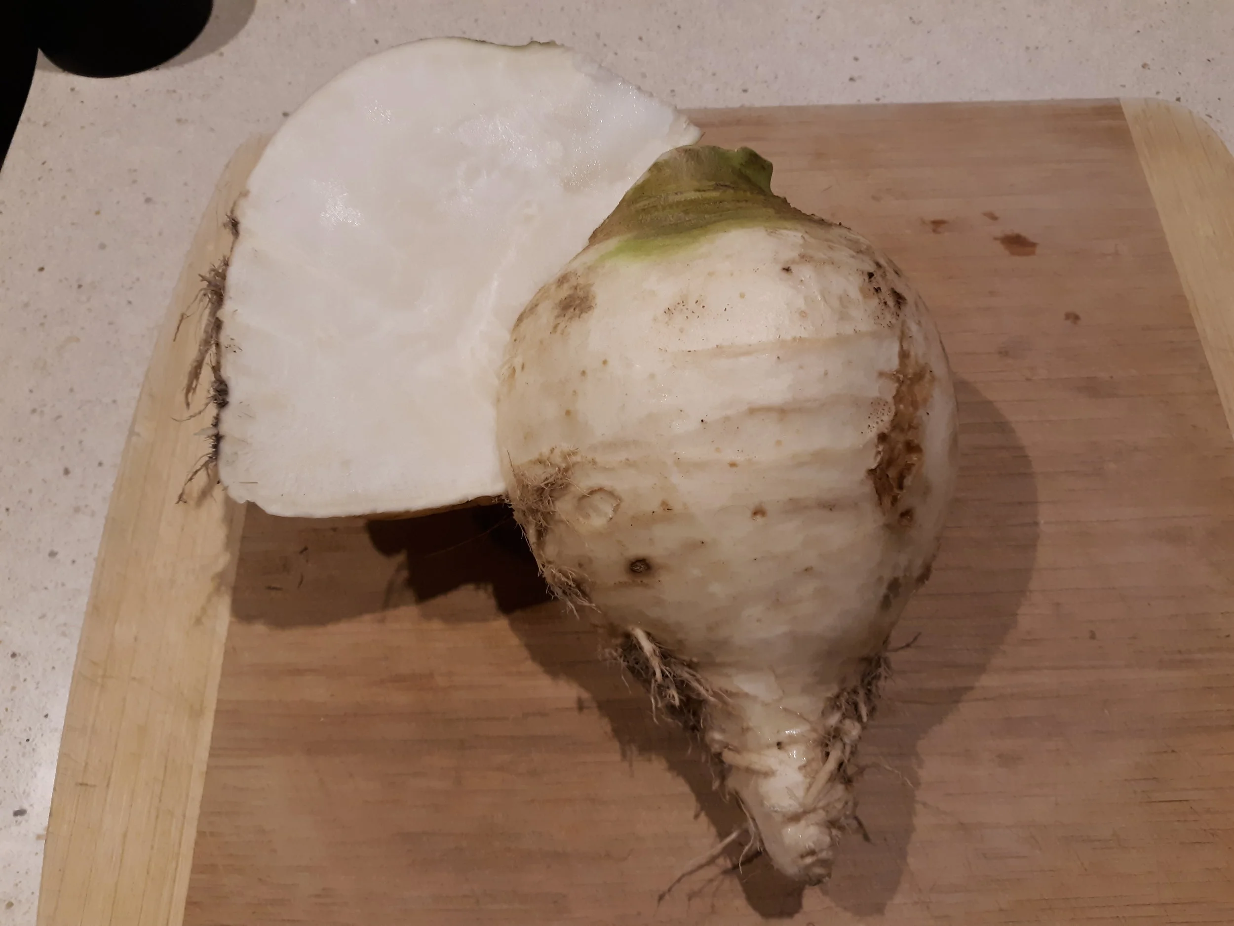 Cut in half and ready to peel and eat raw.
