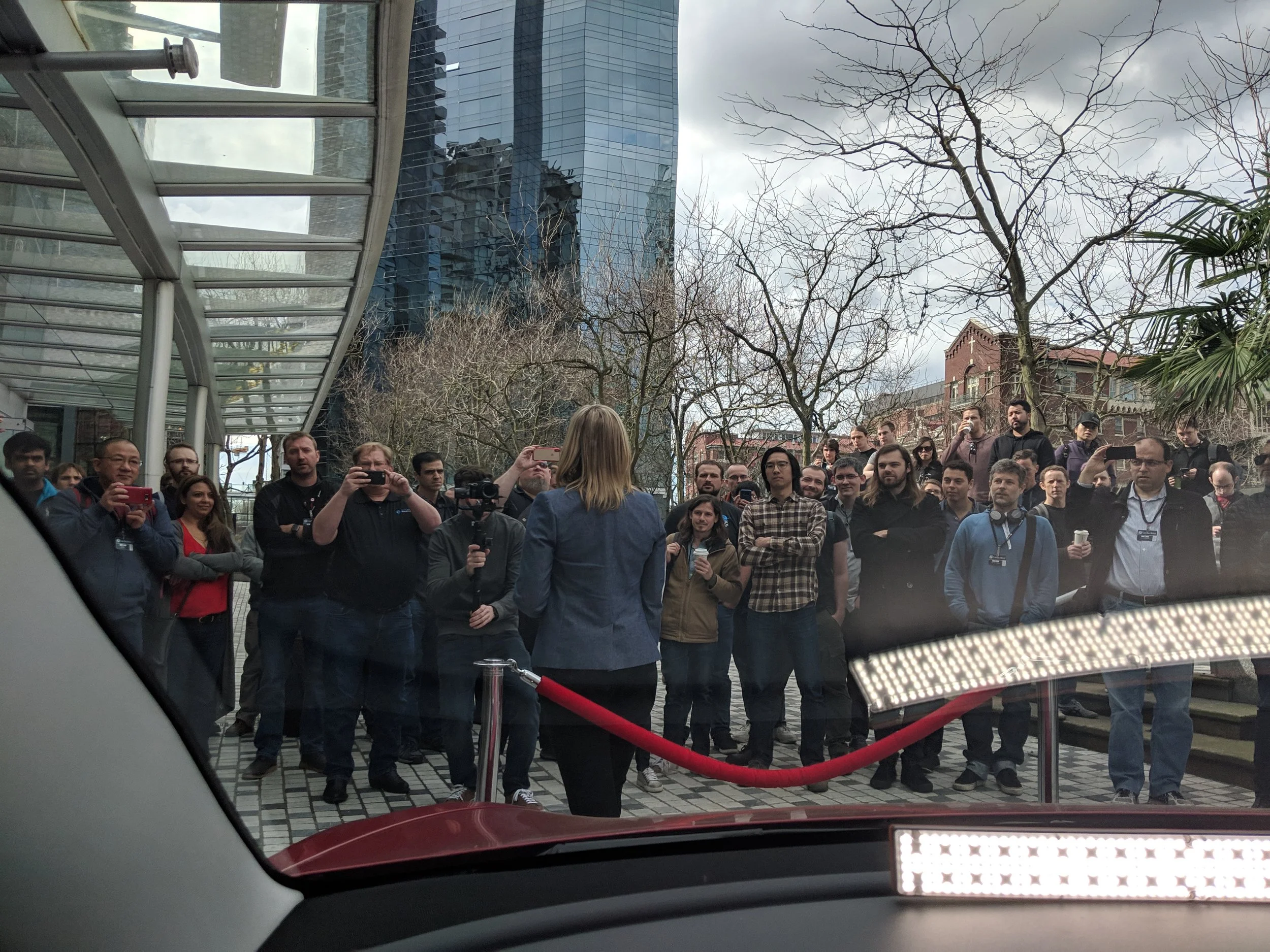 The assembled crowd viewed from within the vehicle