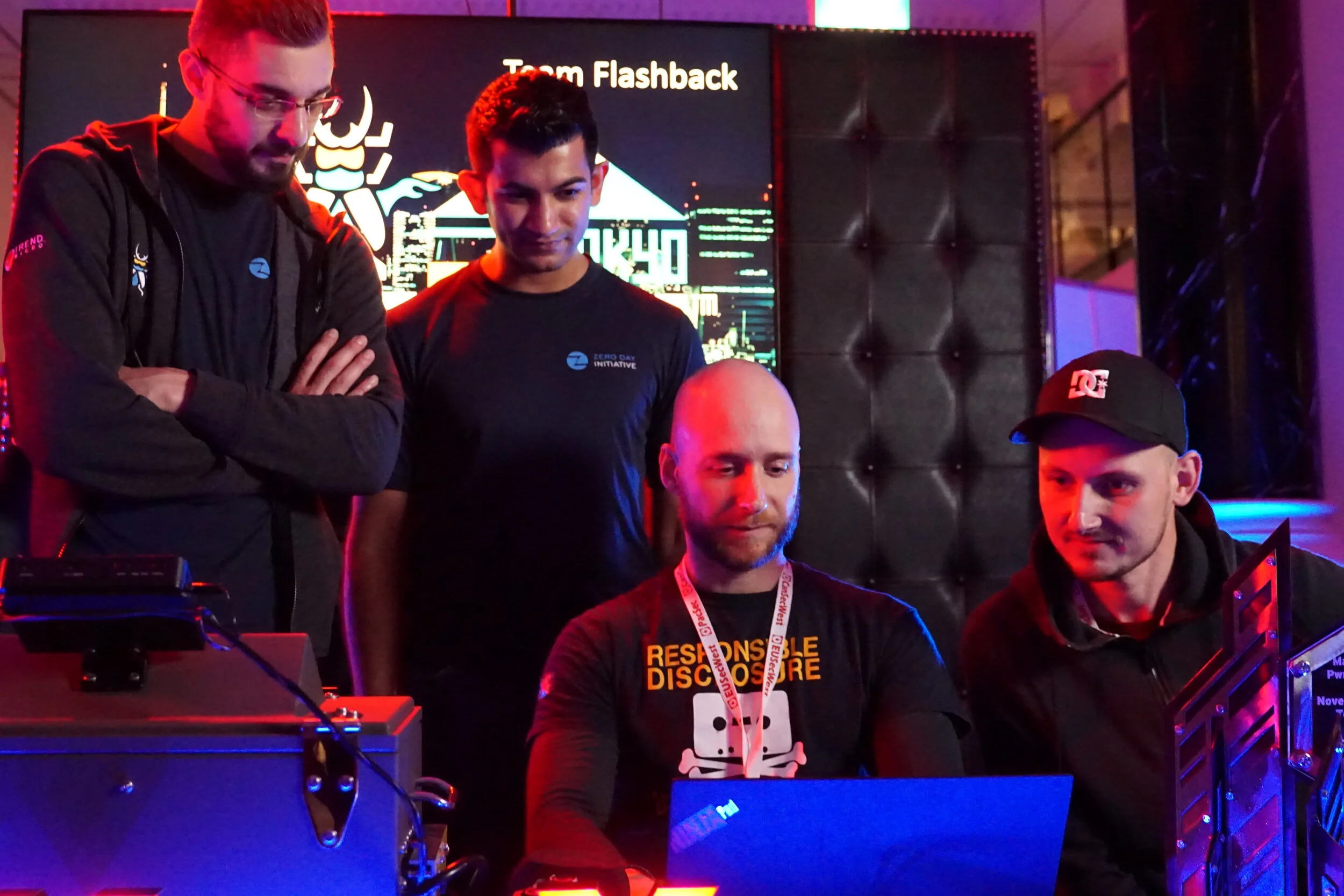 ZDI’s Abdul-Aziz Hariri and Jasiel Spelman observe Pedro Ribeiro and Radek Domanski of Team Flashback