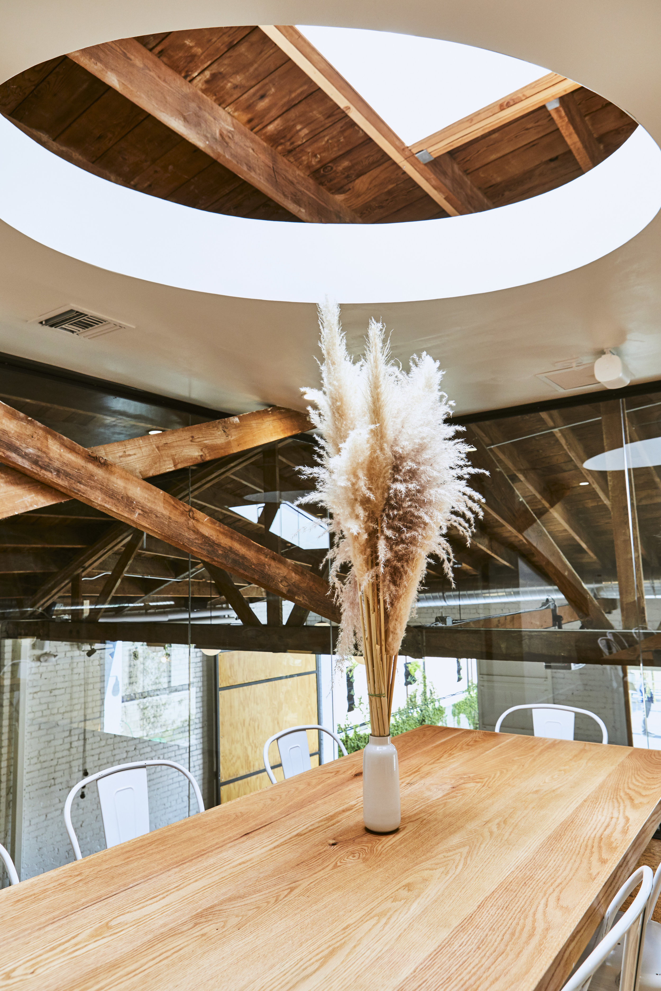  The oval opens up to an oversized skylight. The conference room is full of natural light. 