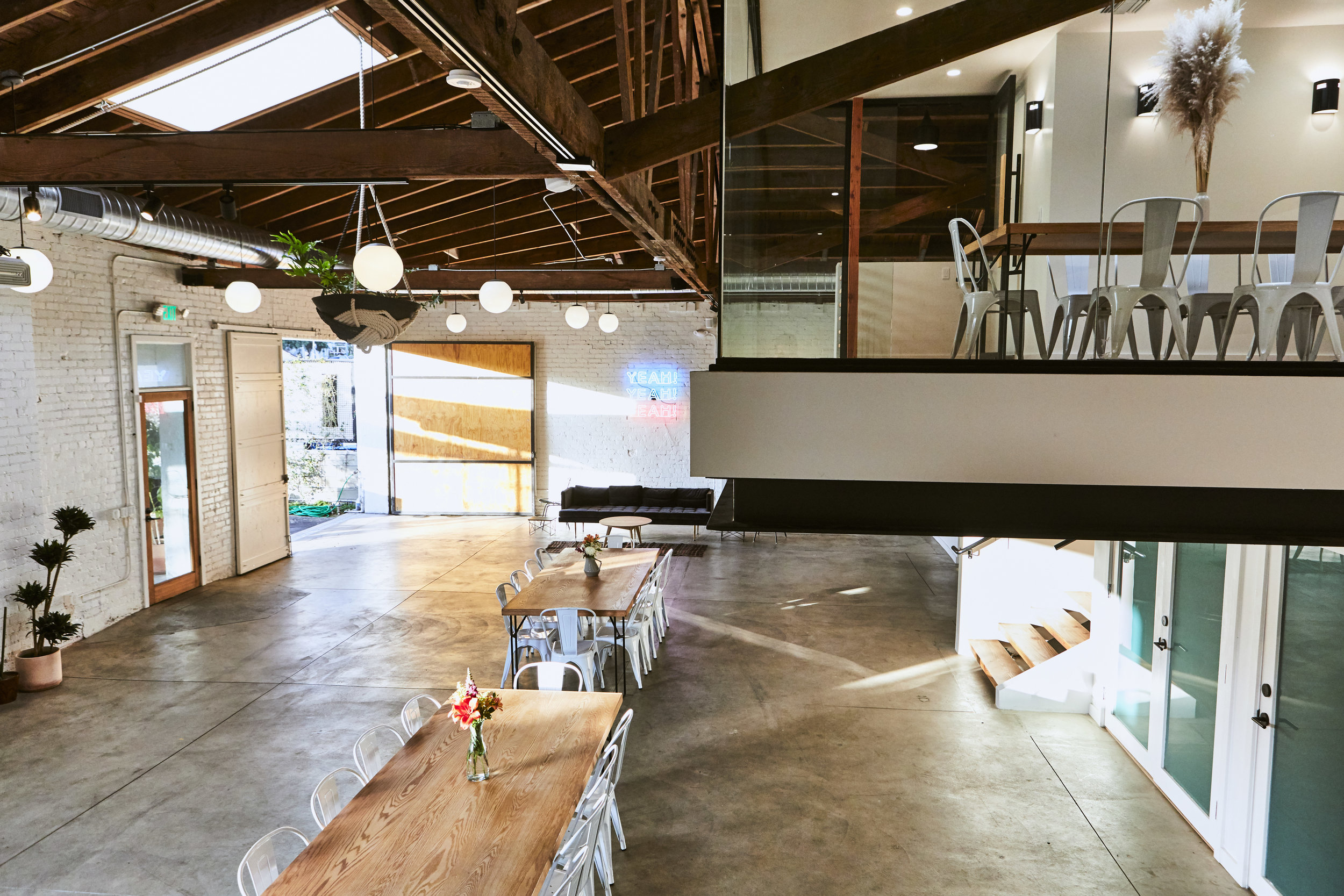  The conference room floats above the main space on a massive steel frame. 