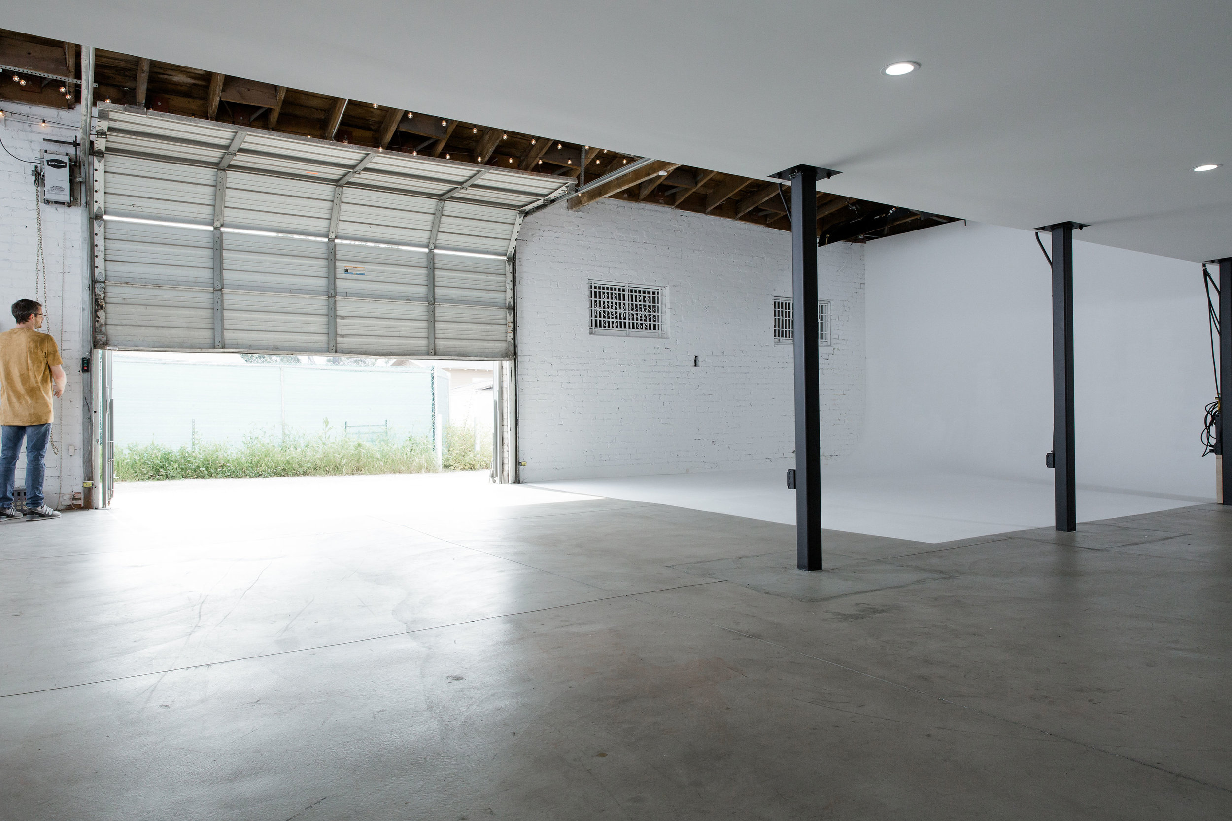  A large garage door make load in and out from the alley super easy. 