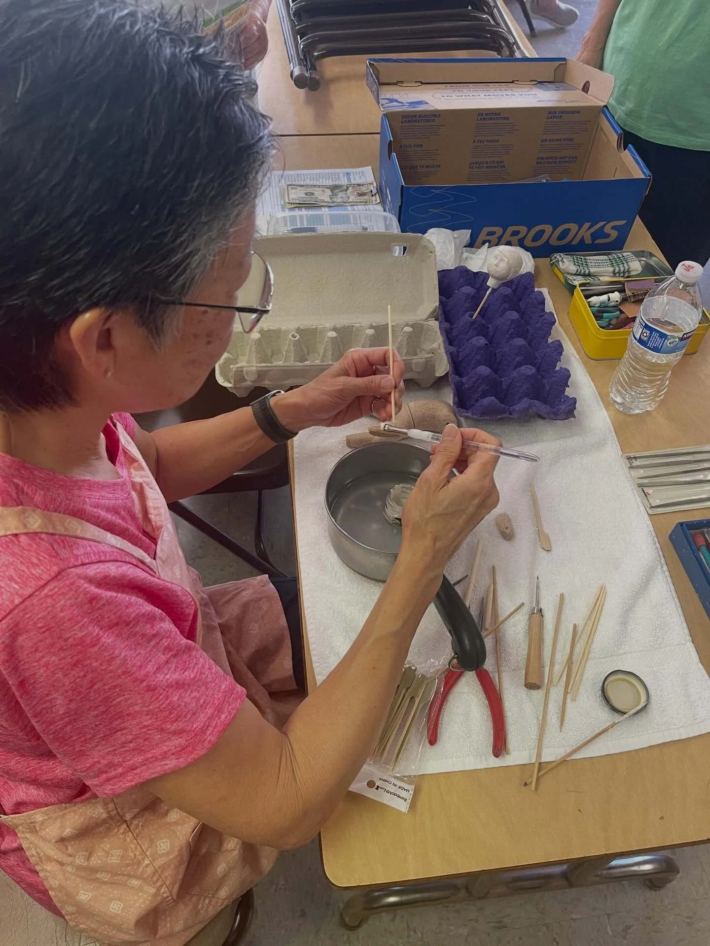 Applying the first layer of gofun (ji nuri gofun). Gofun is a mixture of oyster shells and glue that is the base for the Japanese porcelain technique. 

Students are hard at work creating their one of a kind dolls to be shipped to Japan for an upcomi