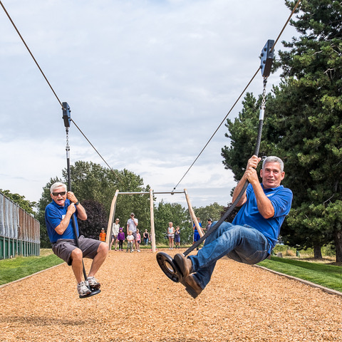 President Kim Carswell and project manager Vice President Allan Calderwood enjoy the zip line