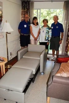 A+new+“sleeper+chair”+is+proudly+shown+at+Tsawwassen’s+KinVillage.+The+Tsawwassen+Boundary+Bay+Lions+Club+assisted+KinVillage+in+fundraising+efforts+to+purchase+the+new+chair.+This+will+allow+friends+and+family+to.webp