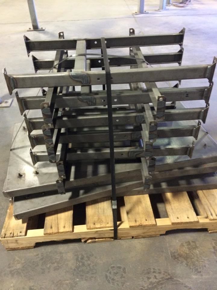 Welded steel access components staged after fabrication at SAFE-T-FAB.