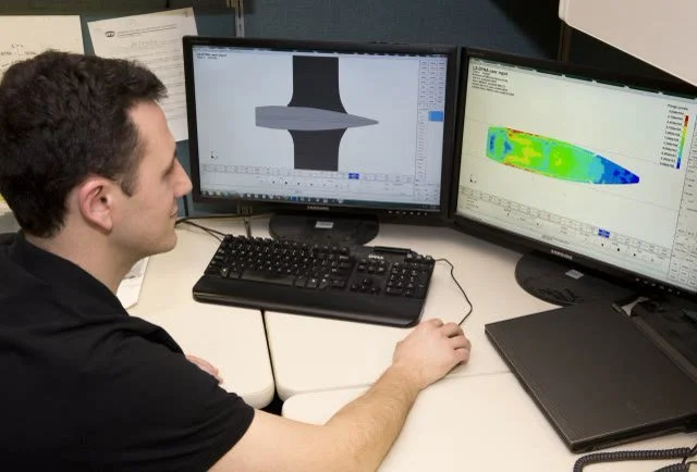 A SAFE-T-FAB designer modelling an access structure in CAD at a workstation.