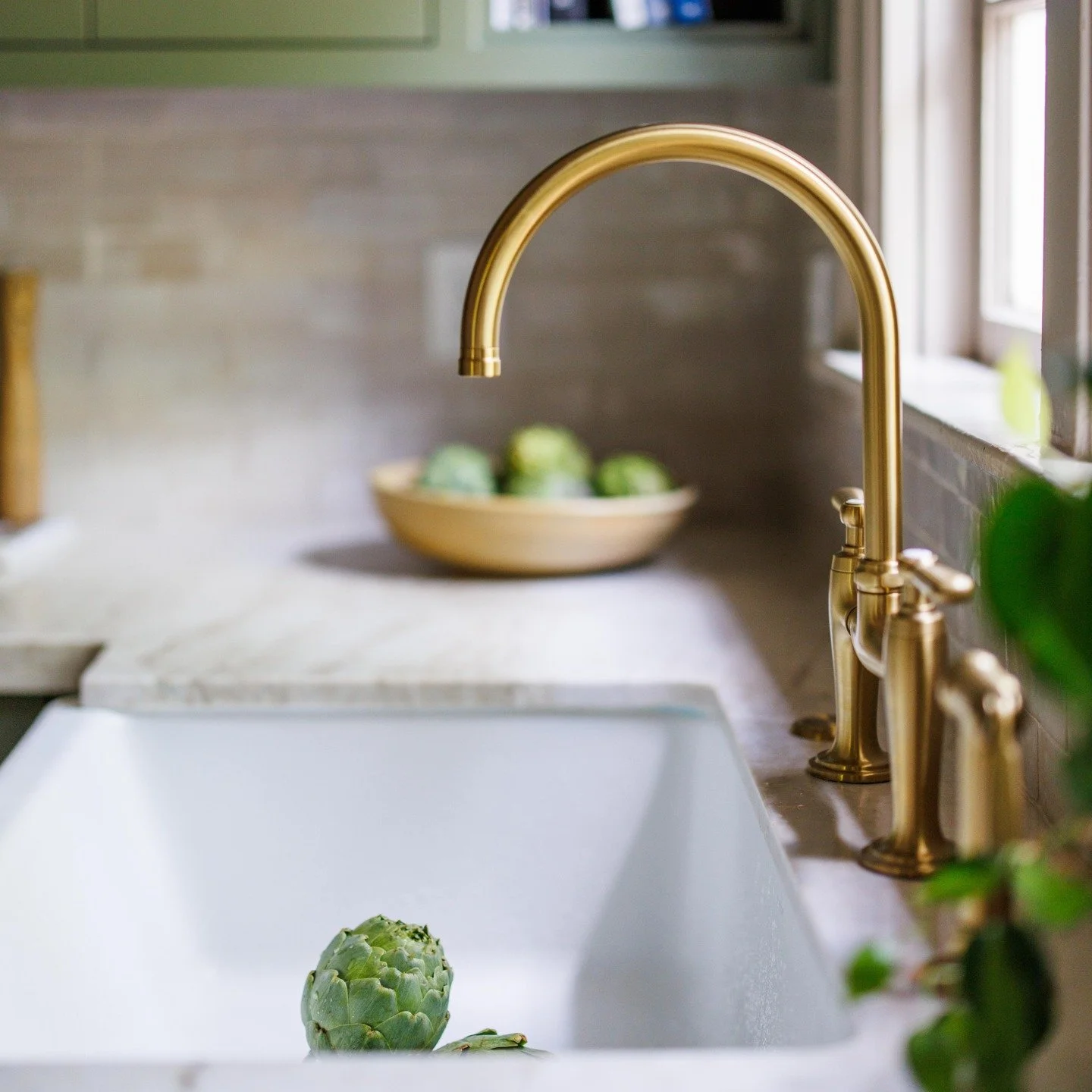 When thinking through all of the details that come together to make a beautiful space, we can't forget the kitchen faucet. And isn't she a stunner?