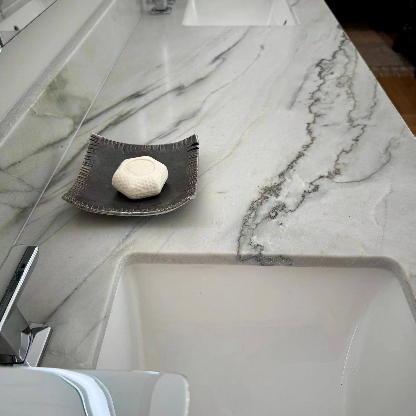 Gorgeous stone for this primary bath from Chico Design Center.