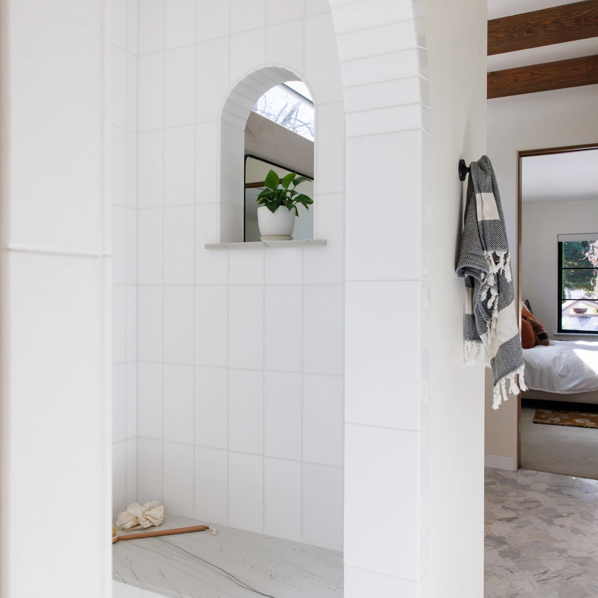 The cutest peak-a-boo arched window. Details matter, like this one designed for our client to be able to take in every detail while enjoying their primary bathroom. 🛀

Photo by @lindsey_king_photography 

#primarybathroom #archdetail #showerideas #s