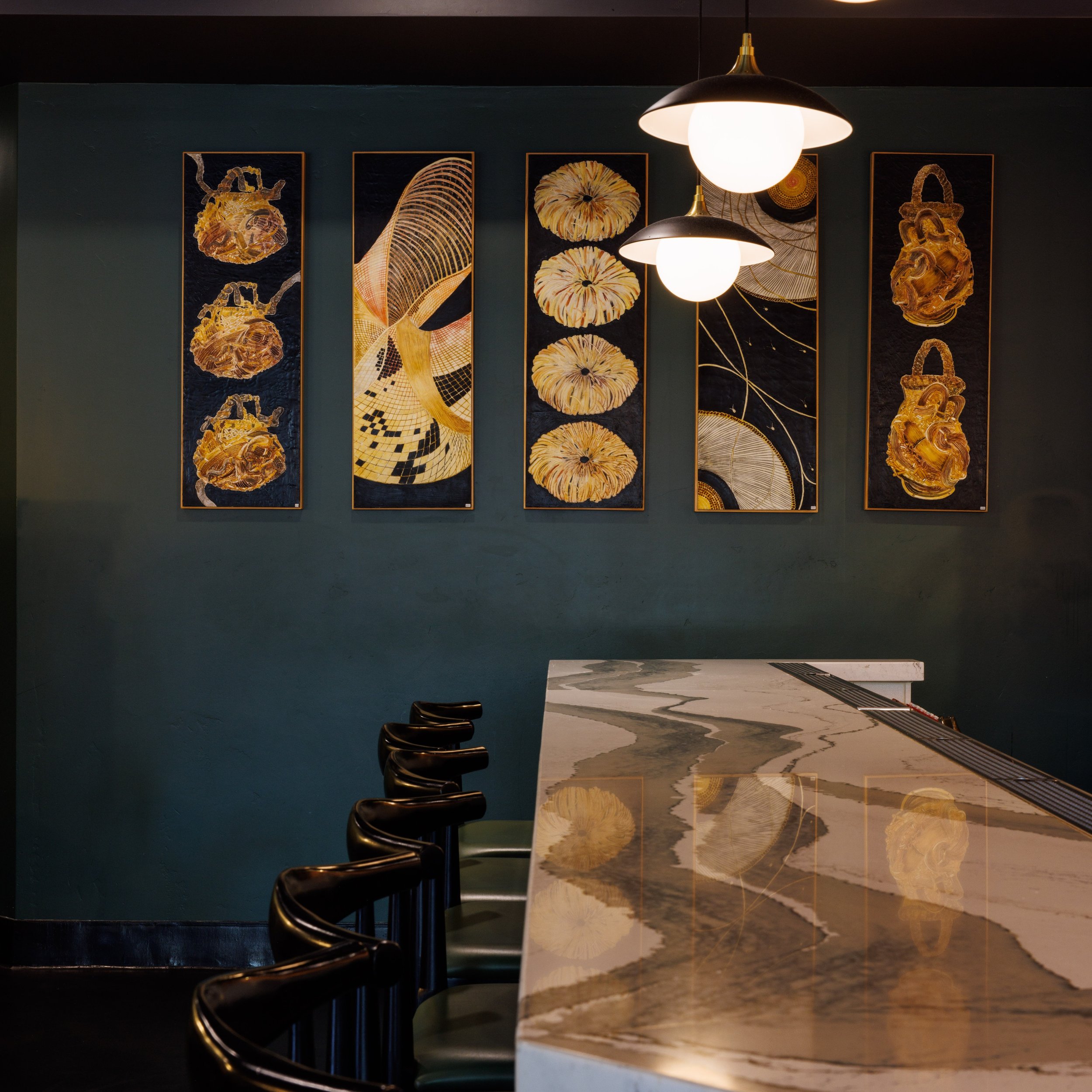 When dreaming about a space and what story I want to help convey, I sit and imagine what it will feel like to be in that place when it is finished. Reality superseded imagination at the Rawbar thanks in part to Paula Busch's art which fit perfectly i