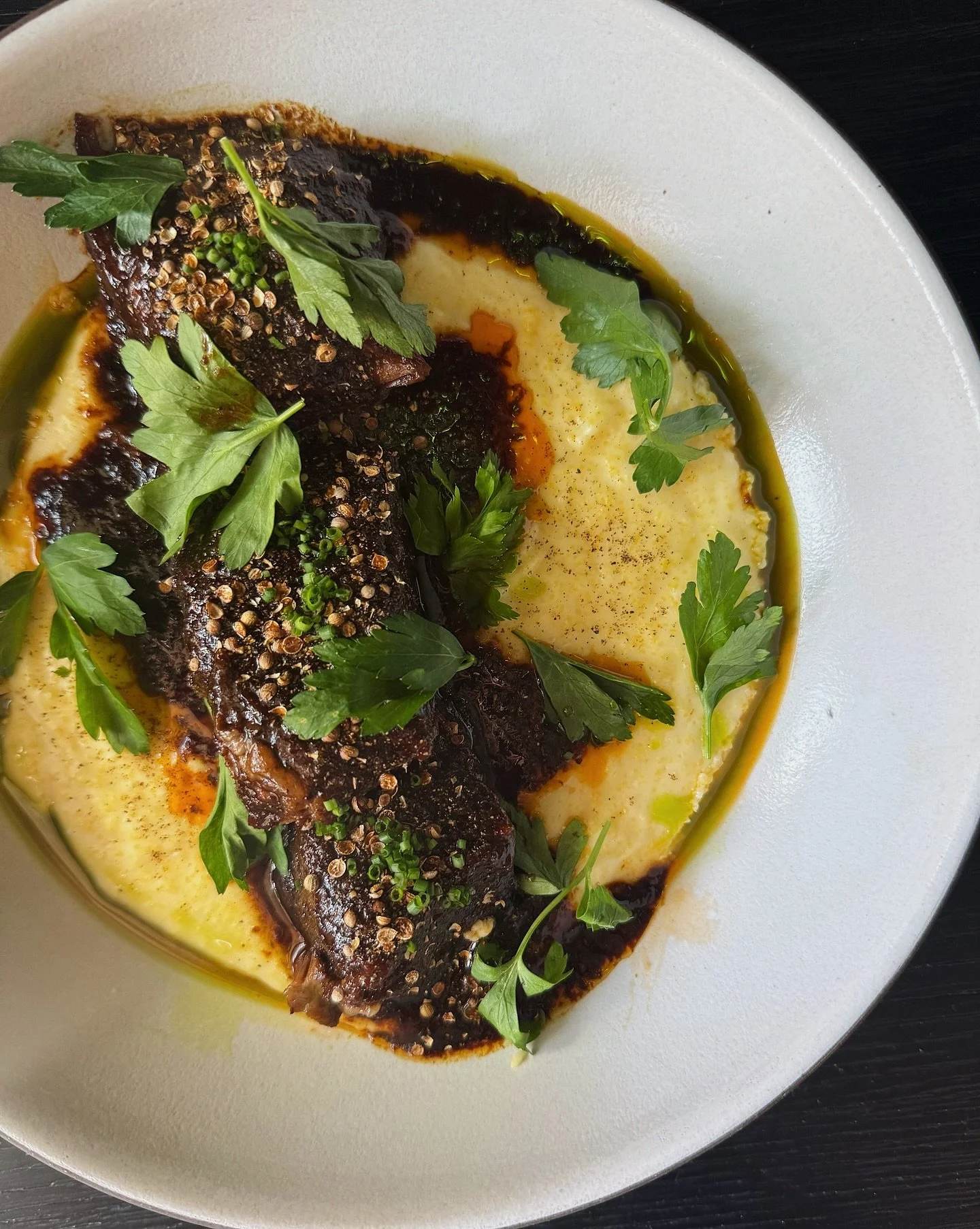 A special feature dish this weekend: Beef Short Rib au Poivre with ultra-creamy Polenta Aligot &mdash; finished with fresh cracked coriander and black pepper.