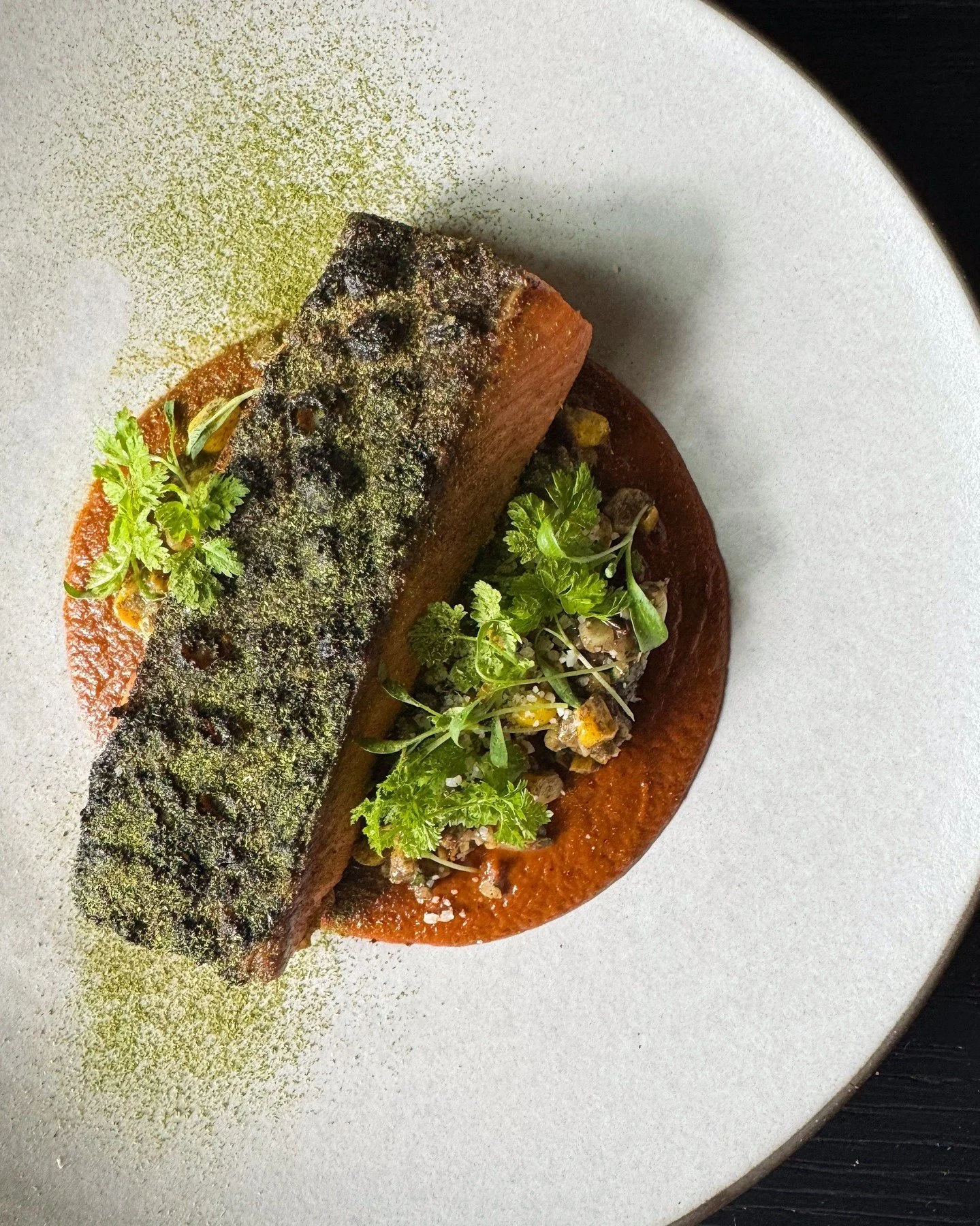 Salmon, served over a roasted carrot pipi&aacute;n, charred corn esquites, and finished with Grana Padano, epazote powder, and micro cilantro. Now on the menu for dinner.

#vendemmiaseattle #seattlerestaurant #seattlefood