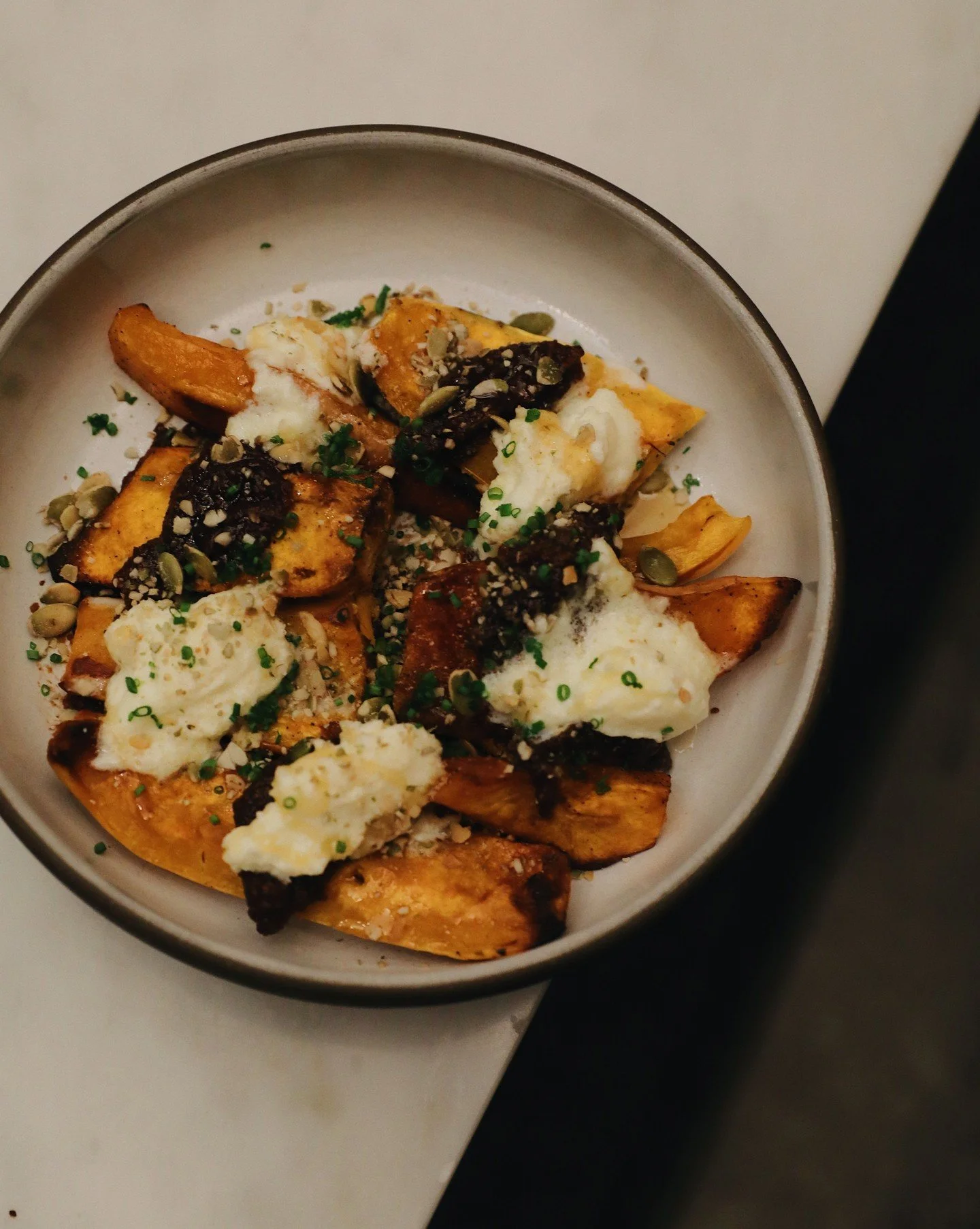 Sweet roasted baby butternut squash paired with mission fig pur&eacute;e, softened in red wine, finished with stracciatella and pepitas.

Happy new year folks! We look forward to having you in. ✨ 

#generalharvestseattle #seattlerestaurant #butternut
