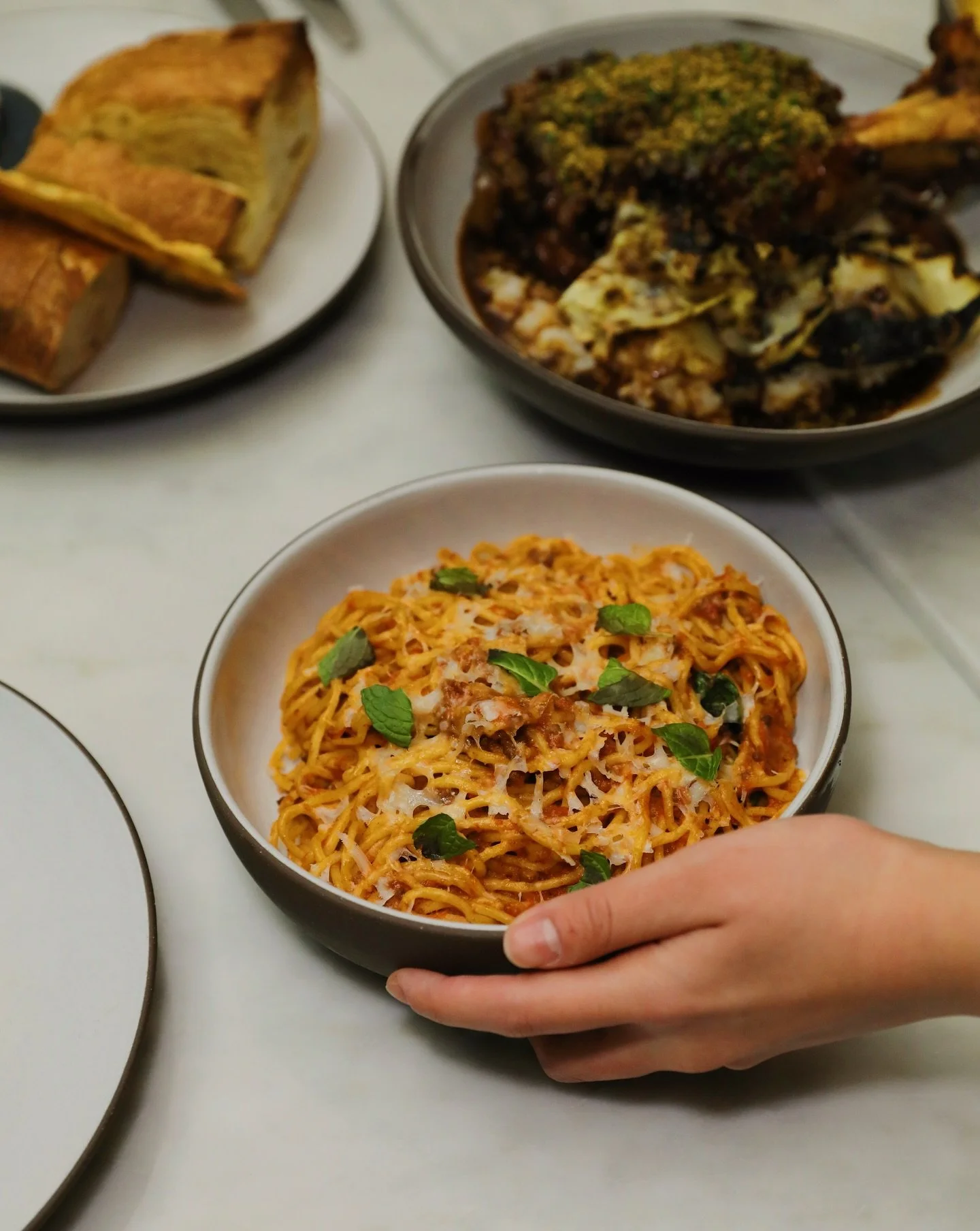A deeply comforting tonnarelli, built on a Bolognese of dry-aged American Wagyu, gently simmered with tomato, mint, mascarpone, and parmesan.

Made to be enjoyed with good company.

#seattlepasta #seattlerestaurant #pasta #seattledinner