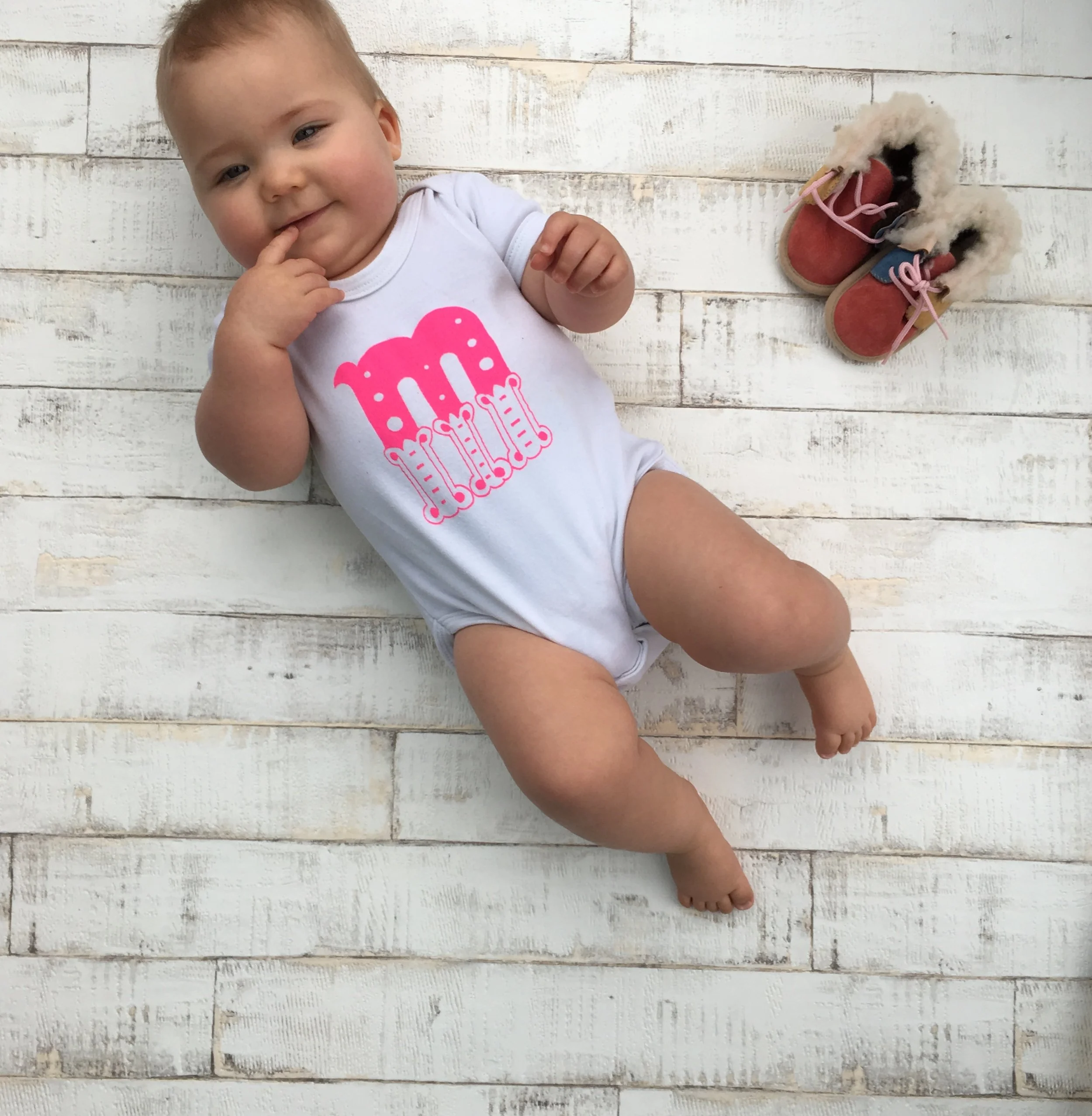 Personalised organic baby bodysuit with initial printed in your choice of letter and colour