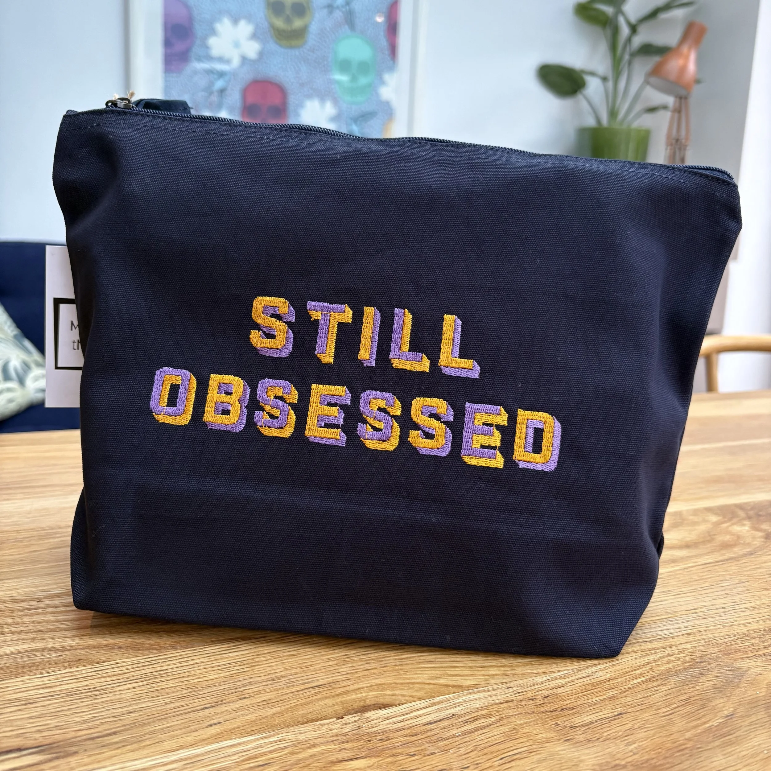 'STILL OBSESSED' Zip Up Pouch