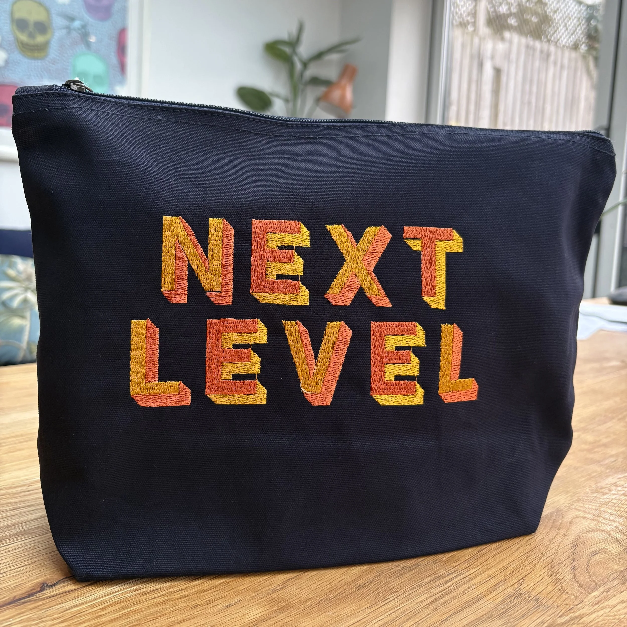 ‘NEXT LEVEL’ Zip Up Pouch