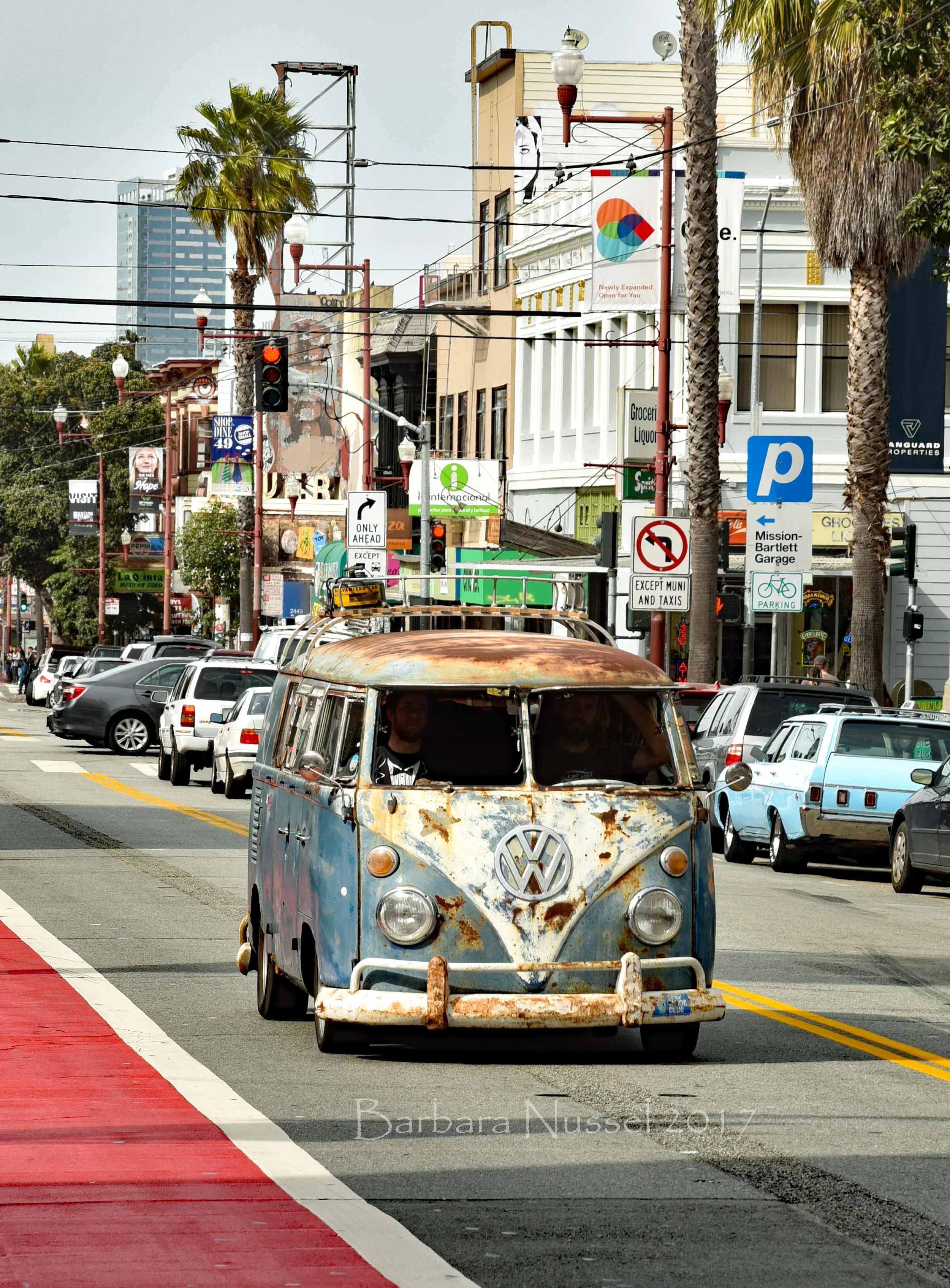 A very vintage VW bus rolling down Mission Street