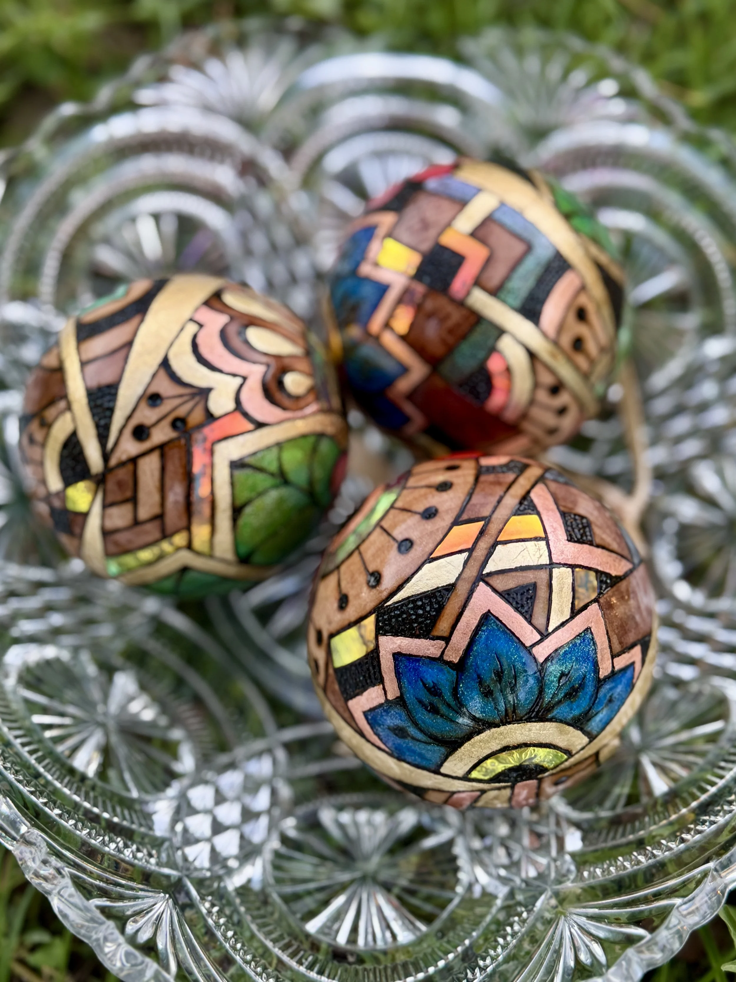 Holographic Firelight Orb from Chrysalis Austin, glowing sphere blending pigment, gilding, and resin light.